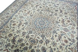 Backside of handmade New Nain rug showing knot structure and weave density