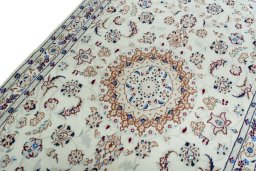 Backside of handmade New Nain rug showing knot structure and weave density