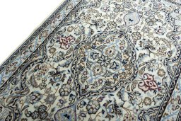 Backside of handmade New Nain rug showing knot structure and weave density