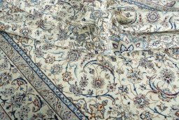 Surface texture of 2000s Nain rug with natural Wool and intricate pattern