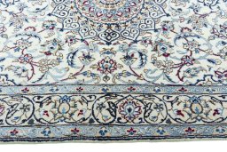 Corner detail of New Nain rug showing border pattern and Wool pile