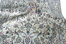 Surface texture of New Nain rug with natural Wool and intricate pattern