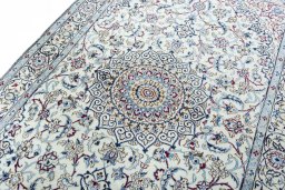 Backside of handmade New Nain rug showing knot structure and weave density