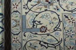 Backside of handmade New Nain rug showing knot structure and weave density