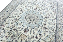 Backside of handmade New Nain rug showing knot structure and weave density