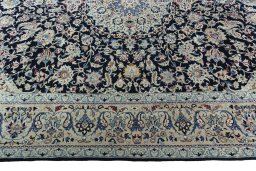 Corner detail of 2000s Nain rug showing border pattern and Wool pile