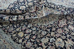 Surface texture of 2000s Nain rug with natural Wool and intricate pattern