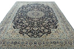 Surface texture of 2000s Nain rug with natural Wool and intricate pattern