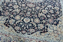 Close-up detail of 2000s Nain rug from Iran / Persia showing Wool weave