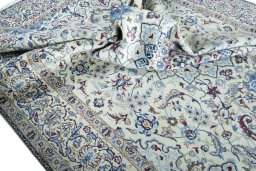 Surface texture of 2000s Nain rug with natural Wool and intricate pattern