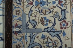 Backside of handmade 2000s Nain rug showing knot structure and weave density