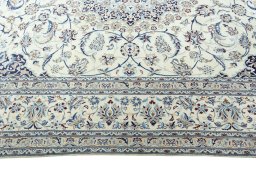 Corner detail of 2000s Nain rug showing border pattern and Wool pile