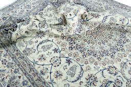 Surface texture of 2000s Nain rug with natural Wool and intricate pattern