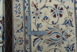 Backside of handmade 2000s Nain rug showing knot structure and weave density