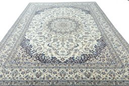 Surface texture of 2000s Nain rug with natural Wool and intricate pattern