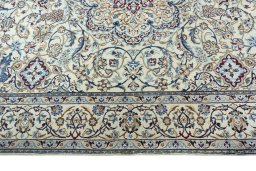 Corner detail of 2000s Nain rug showing border pattern and Wool pile