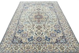 Surface texture of 2000s Nain rug with natural Wool and intricate pattern