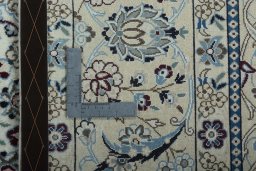Backside of handmade New Nain rug showing knot structure and weave density