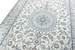 Backside of handmade New Nain rug showing knot structure and weave density