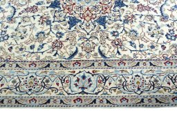 Corner detail of 2000s Nain rug showing border pattern and Wool pile