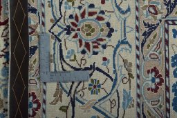 Backside of handmade 2000s Nain rug showing knot structure and weave density