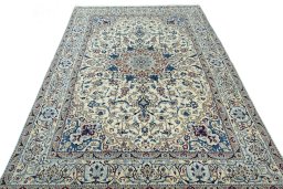 Surface texture of 2000s Nain rug with natural Wool and intricate pattern