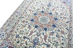 Backside of handmade 2000s Nain rug showing knot structure and weave density