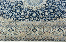 Corner detail of 2000s Nain rug showing border pattern and Wool pile