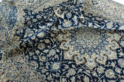 Surface texture of 2000s Nain rug with natural Wool and intricate pattern
