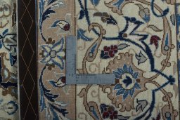 Backside of handmade 2000s Nain rug showing knot structure and weave density