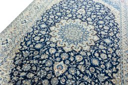 Backside of handmade 2000s Nain rug showing knot structure and weave density