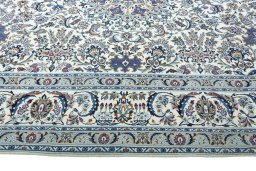 Corner detail of 2000s Nain rug showing border pattern and Wool pile