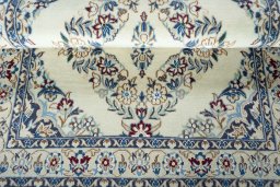 Close-up detail of 2000s Nain rug from Iran / Persia showing Wool weave