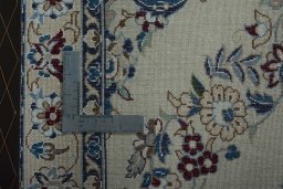Surface texture of 2000s Nain rug with natural Wool and intricate pattern
