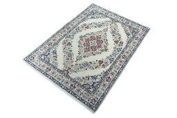 Corner detail of 2000s Nain rug showing border pattern and Wool pile