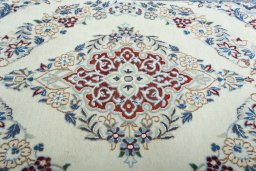 Central medallion detail of 2000s Nain rug from Iran / Persia