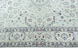 Corner detail of 2000s Nain rug showing border pattern and Wool pile