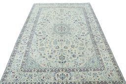 Surface texture of 2000s Nain rug with natural Wool and intricate pattern