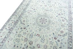 Backside of handmade 2000s Nain rug showing knot structure and weave density