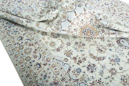 Surface texture of 2000s Nain rug with natural Wool and intricate pattern