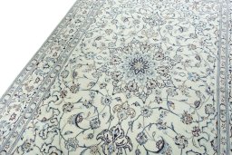 Backside of handmade New Nain rug showing knot structure and weave density