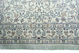 Full view of New Nain rug from Iran / Persia, 302 × 195 cm in Beige tones