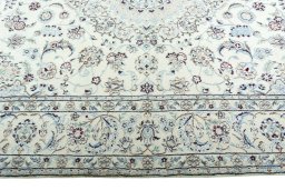 Corner detail of 2000s Nain rug showing border pattern and Wool pile