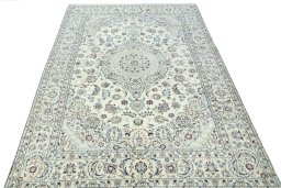 Surface texture of 2000s Nain rug with natural Wool and intricate pattern