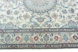 Corner detail of 2000s Nain rug showing border pattern and Wool pile