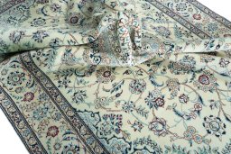 Surface texture of 2000s Nain rug with natural Wool and intricate pattern