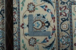 Backside of handmade 2000s Nain rug showing knot structure and weave density