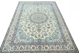 Surface texture of 2000s Nain rug with natural Wool and intricate pattern