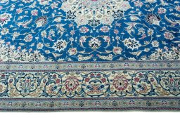Corner detail of 2000s Nain rug showing border pattern and Wool pile