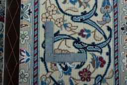 Backside of handmade 2000s Nain rug showing knot structure and weave density